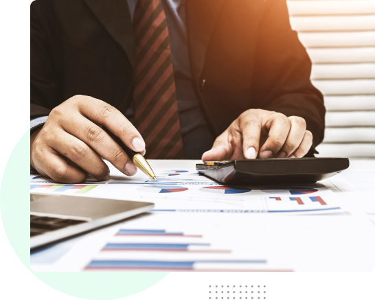 working professional using calculator on desk